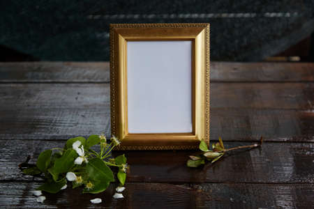 Bright cinematic photo frame with a blossoming branch. Minimalistic mockup.