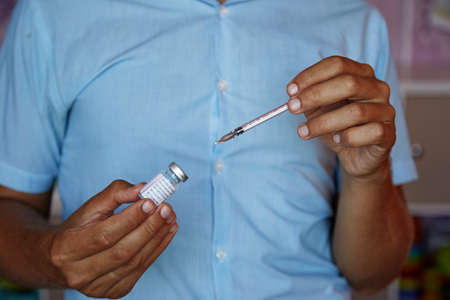 Kyiv, Ukraine - June 26, 2021: AstraZeneca vaccine. Vaccinations during coronavirus. Vaccine bottles effective in preventing Covid-19 infections. High quality photoのeditorial素材