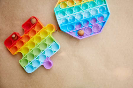 toy with hazel nuts. Invented games for motor skills development. Rainbow sensory fidget push it....
