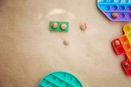 Curious came up with a game with a trendy pop it toy and hazelnuts. Game for the development of...