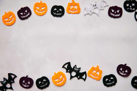 Happy Halloween decorations with bats, cute pumpkins. View from above. Minimalistic holiday concept. Copy space for text. Happy Halloween, trick or treat concept. High quality photoの写真素材