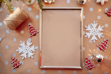 Christmas homemade gingerbread cookies with mockup frame. Homemade baked cookies and fir tree....