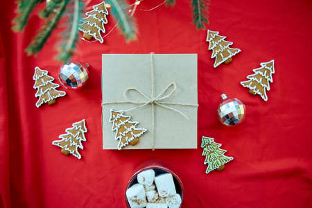 Festive card with gift box, crafting decoration, disco balls, Christmas cookies of Christmas tree...