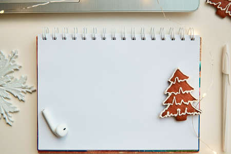 Mockup of notebook with New Year's decorations. The concept of New Year's decisions and resolutions with setting goals for the year. Bokeh on foreground. Christmas mock up. High quality photoの写真素材