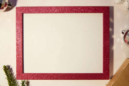 Festive vintage retro card with mock up of pink frame, crafting decoration, branch of fir tree,...