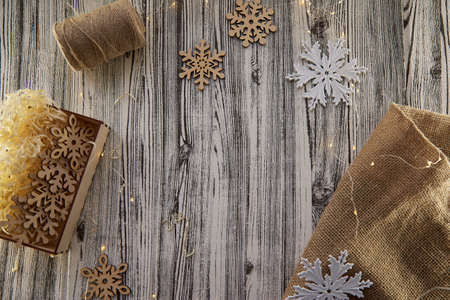 Organic design of Christmas background. Wooden and textile crafting ornaments and modern white fluffy decorations. Copy space. High quality photoの写真素材