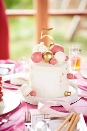 Birthday pink girly 5th anniversary cake. Corporate party, company anniversary concept. Pink dessert...