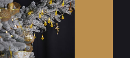 Luxury festive Christmas background. Stylish trendy silver Christmas tree and decorations on black background. Extra wide banner. Copy space.の写真素材