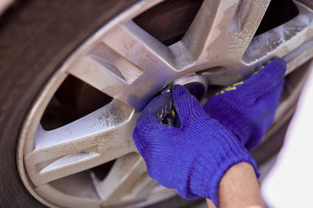 Close up of changing tires on the car with tools. Seasonal needs for safety. safety concept....