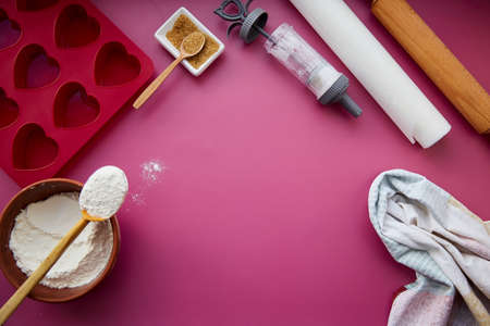 Preparing for baking: heart-shaped silicone mold, rolling pin, confectionery syringe, glaze, flour,...