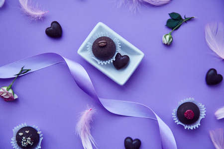 Chocolate sweets and hearts. Trendy pink feathers. Delicate purple very pericolor pattern. Birthday,...
