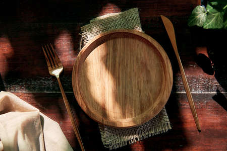 Menu or recipe mockup wooden plate, podium. Invitation, postcard mockup under hard shadows. Place...