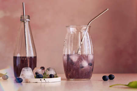 Organic natural non-alcoholic chia drink with blueberries, seeds, basil extract, leaves, ice....