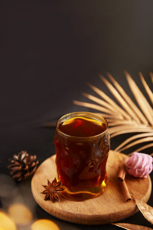 Festive coffee with cinnamon and cardamom among Christmas decorations. Christmas aesthetic drink.の写真素材