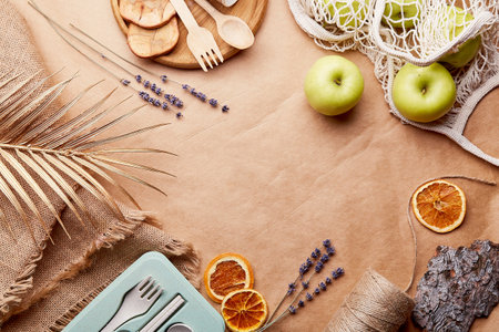 Eco friendly background. Wooden and natural cutlery, apples, bark tree, lavender. Sustainable, zero waste, plastic free lifestyle. copyspace.の写真素材
