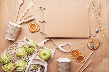 Natural craft paper mock up among wooden cutlery and cardboard cups. Eco-friendly, zero waste concept. Sustainable, plastic free lifestyle. copyspace.の写真素材
