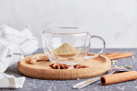 Healthy indian masala tea. Traditional hot drink with milk and spices, cardamom, star anise, cinnamon flat lay.の写真素材