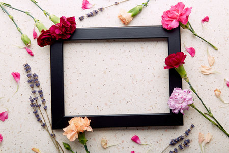 Colorful flowers on natural background. Wishing, invitation, birthday, wedding, Mother, Womens day creative background flat lay. copy spaceの写真素材