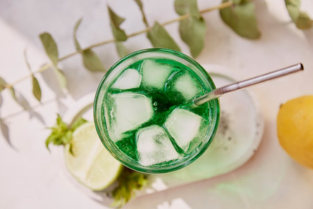Non alcoholic healthy detox citrus green sparkling mocktail. Vitaminized healthy drink. Green...