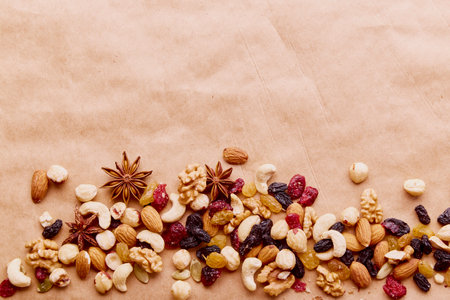 Assorted nuts and raisins on natural rustic background. copyspace.の写真素材