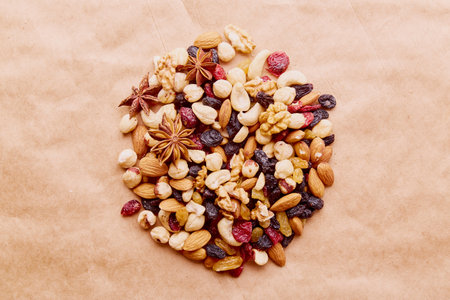 Circle of nuts pile on natural rustic backround. top viewの写真素材