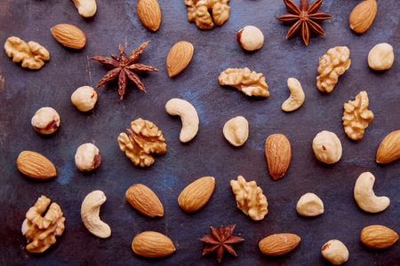 Pattern of assorted nuts and raisins flat lay. Healthy eating, dessert concept. food background