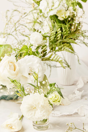 Eustoma, rose, gypsophila flowers. Cozy home, biophilic interior, harmonious place, wedding design table concept.の写真素材