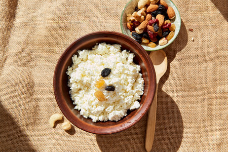 Natural sour milk cheese, rustic cottage cheese with dry fruits and nuts. Healthy breakfast.. Diet, ukrainian foodの写真素材