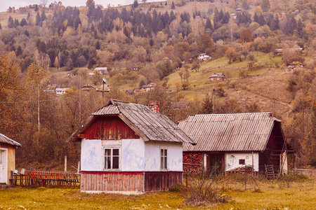 Kryvorivnia, Verkhovyna, October 19 - Autumn rustic background, atmospheric ukrainian rustic houses in gutsul style.のeditorial素材