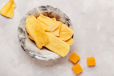 Tropical delight - vibrant shots of delectable dry mango slices top view.