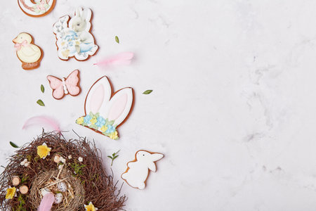 Nest and Easter cookies decorated on white background, copy space flat lay. Easter banner.