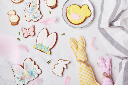 Easter seasonal pastel aesthetics pastry with crafting handmade bunny toy. Happy Easter background top view.の写真素材