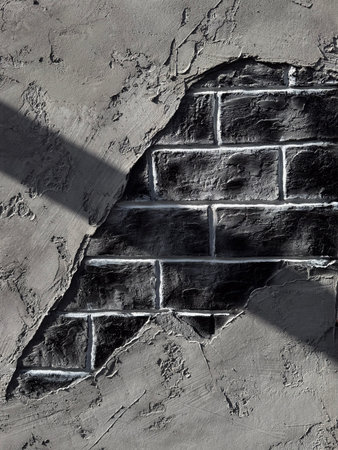 Grunge grey wall with exposed brick and vintage decor. Textured industrial style surface with...