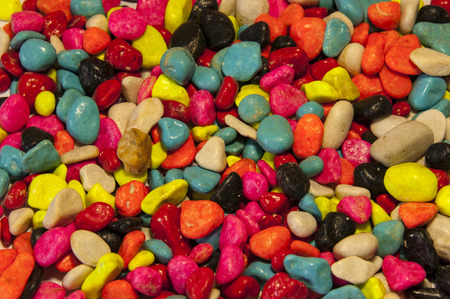 Placer melenkih colored stones, laid out in a chaotic mannerの写真素材