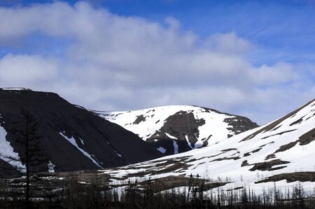 northern snowy mountains against the blue skyの写真素材