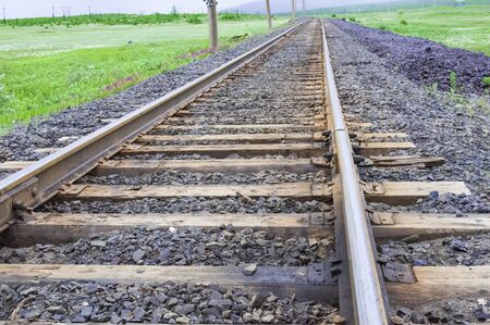 View from close range Railroad going into the distance, in a landscapeの写真素材