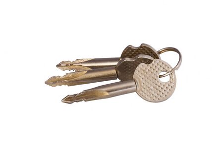 Three keys lie in a sheaf on a white background