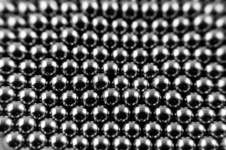 Background from round magnetic metal balls of gray colorの写真素材