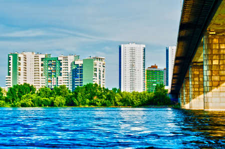 city landscape on the river bank, at the big bridgeの写真素材