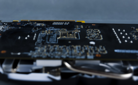 Close-up of the graphics card chip on the back side, computer equipment.の写真素材