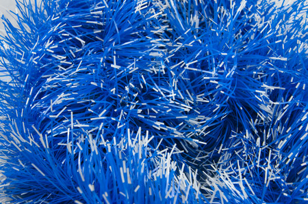 Close-up of blue tinsel with white tips, background.の写真素材