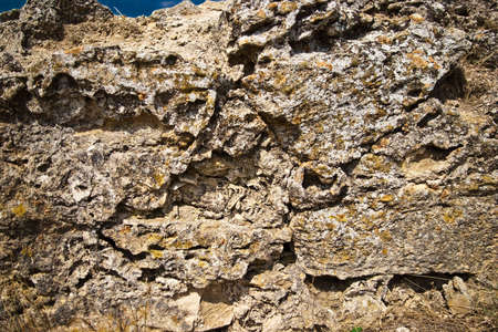 close-up of weathered stone wallの写真素材
