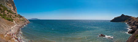 panorama of sea gulf with people bathing in crimeaの写真素材