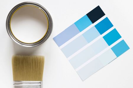 Paint color chart sample swatches, paint brush and tin of paint. Color trend 2020 classic blue....