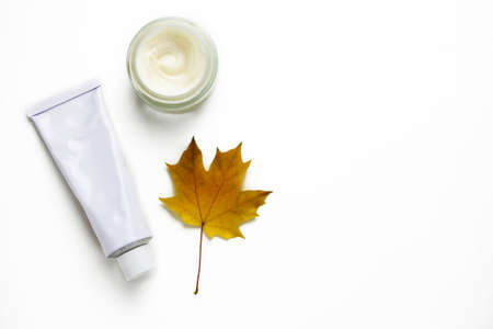Organic autumn face or body cream on white background with copy space. Skin care.の写真素材
