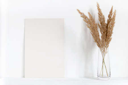 Home interior poster mockup on table. Monochrome, pastel.