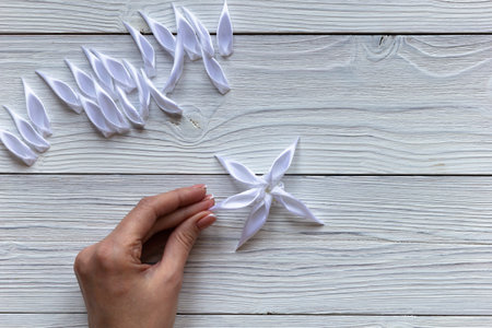 Step by step instruction. How make diy flowers from ribbon for design at home. Step 23. Needlework.の写真素材