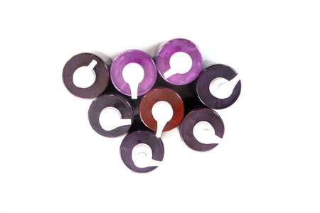 Tube of hair dye isolated in different colors, top view.