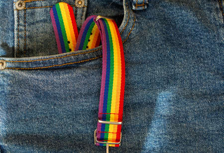 LGBT rainbow headband on solid yellow background with copy space using as celebrate of homosexual, lesbian, gay and transgender concept.の写真素材