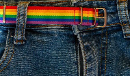 LGBT rainbow headband on solid yellow background with copy space using as celebrate of homosexual, lesbian, gay and transgender concept.の写真素材